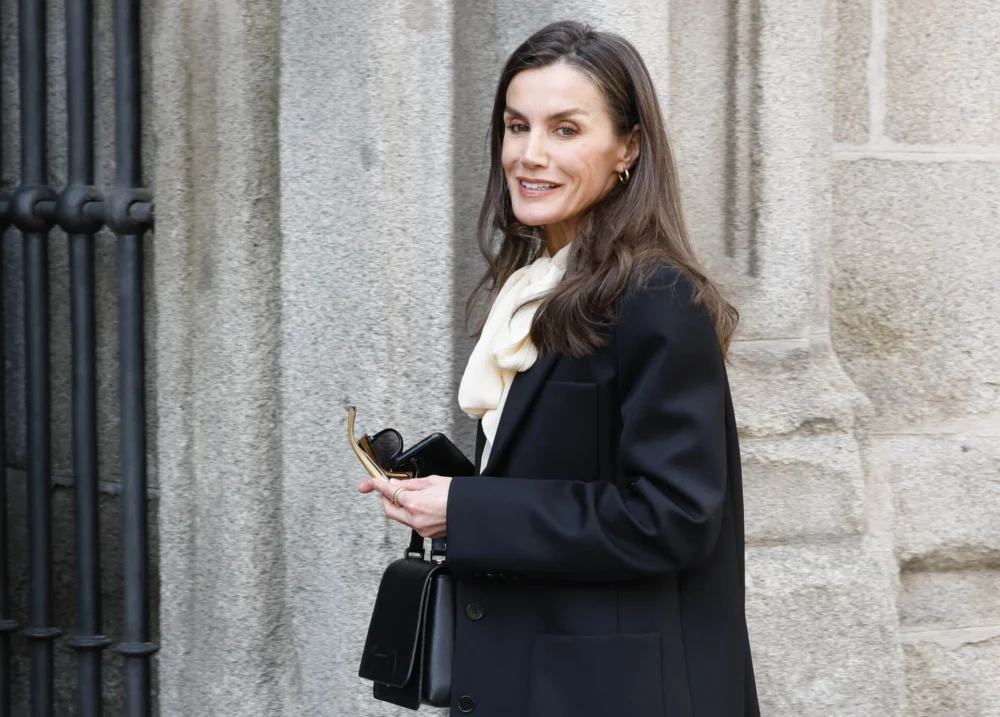 Queen Letizia of Spain Elevates the Pussy Bow Blouse Trend During Official Engagements Supporting Health Initiatives and Honoring Journalistic Legacy
